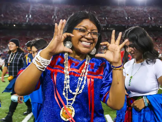 Native American Student with Wildcat hand sign