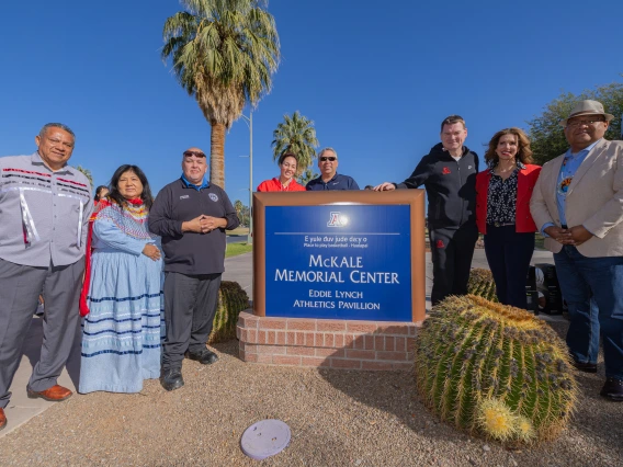 Hualapai Tribe member and Coach Tommy Lloyd with McKale Center Sign