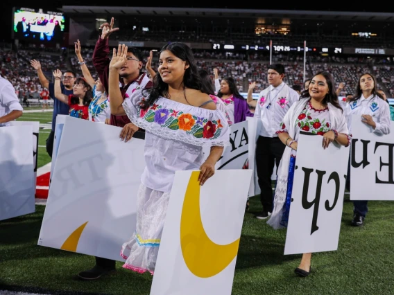 Pascua Yaqui Youth holding tiles